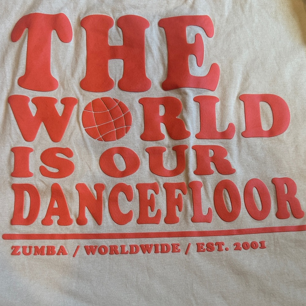Zumba Fitness Beige Tee with Bold Orange Print